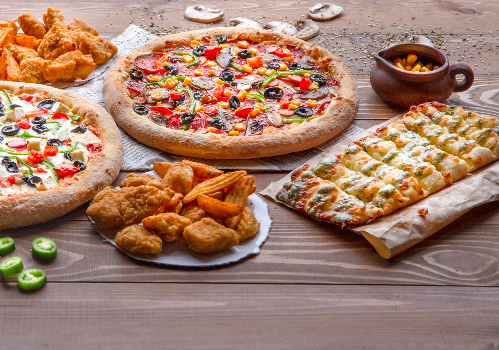 pizzas-chicken-bbq-fried-potatoes-cheese-rolls-wooden-table pizzas-chicken-bbq-fried-potatoes-cheese-rolls-wooden-table